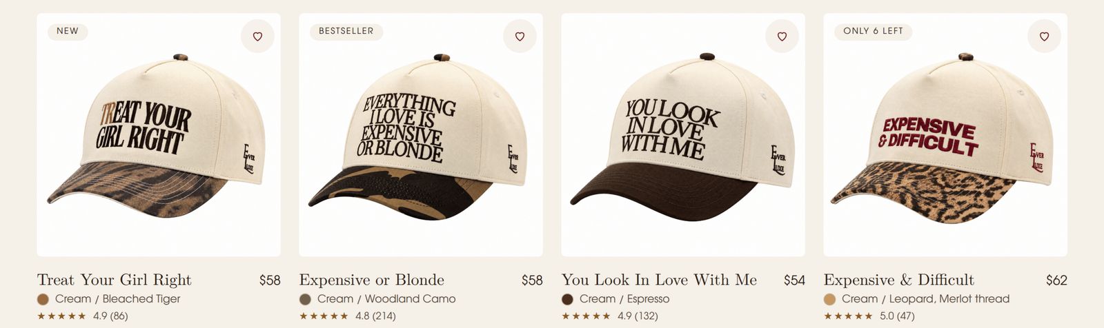 The finished product page: four cream caps with printed slogans, each with its name, colourway and price.
